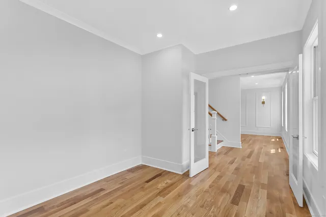 a view of hallway with wooden floor