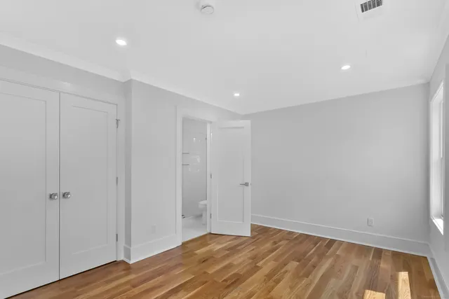 a bathroom with a shower sink and mirror