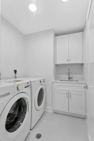 a bathroom with a bathtub and shower