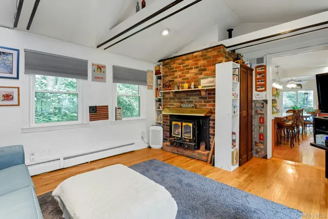 a bedroom with furniture and a fireplace