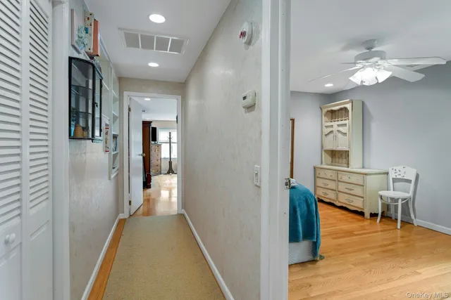 a view of a room with wooden floor and staircase
