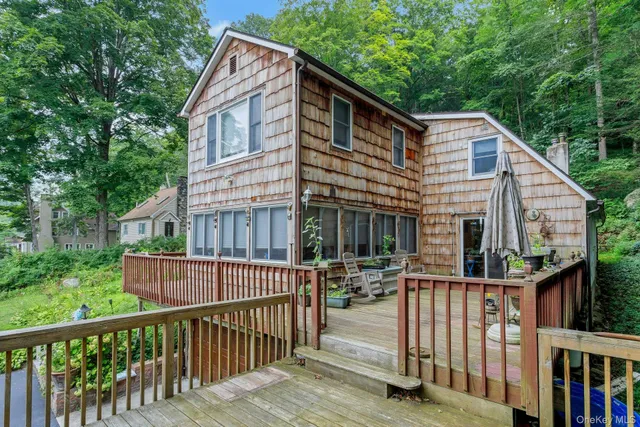 a view of a house with wooden fence