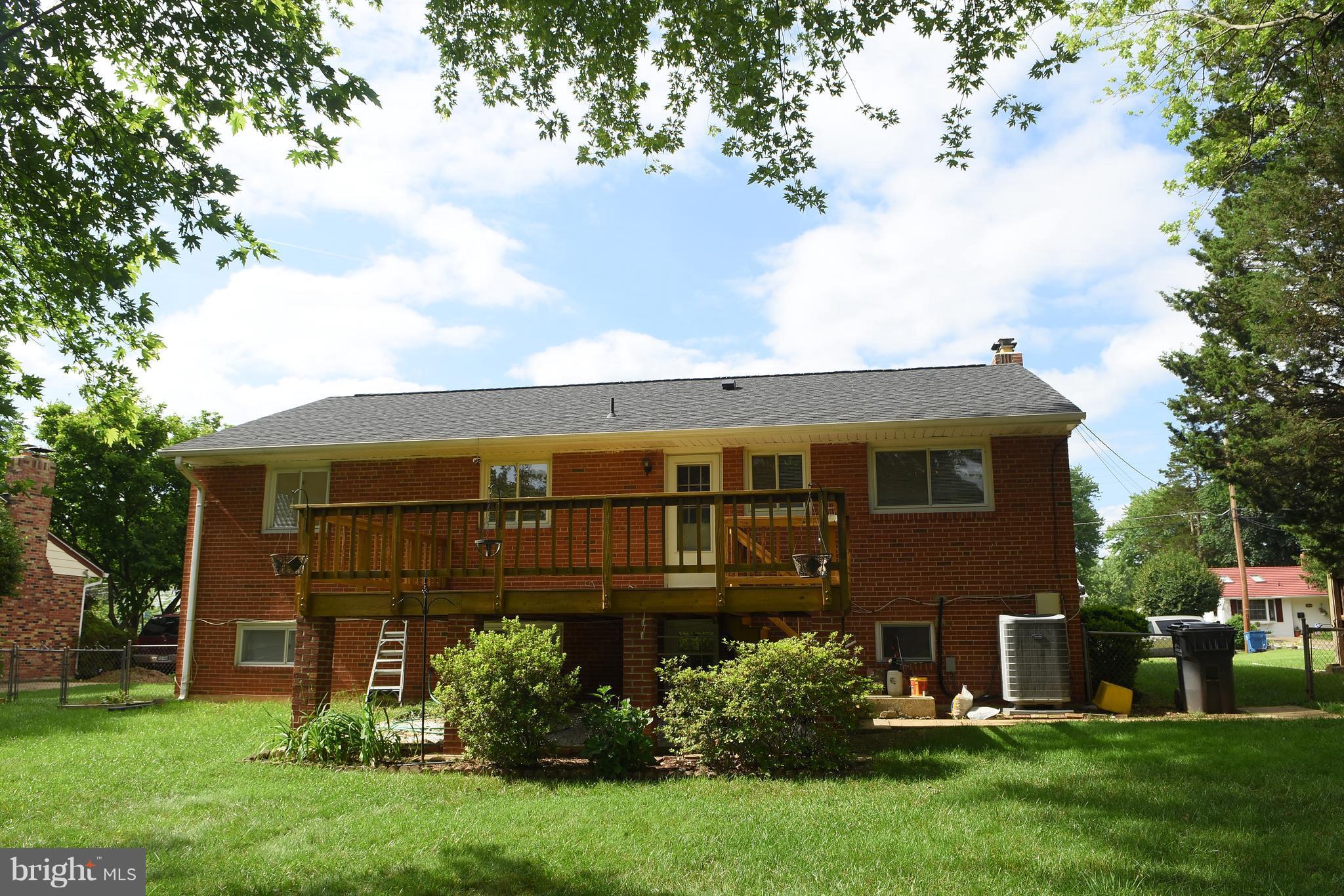 8127 Carrick Lane Springfield, VA 22151 - Photo 2 of 15 front view of a house with a yard
