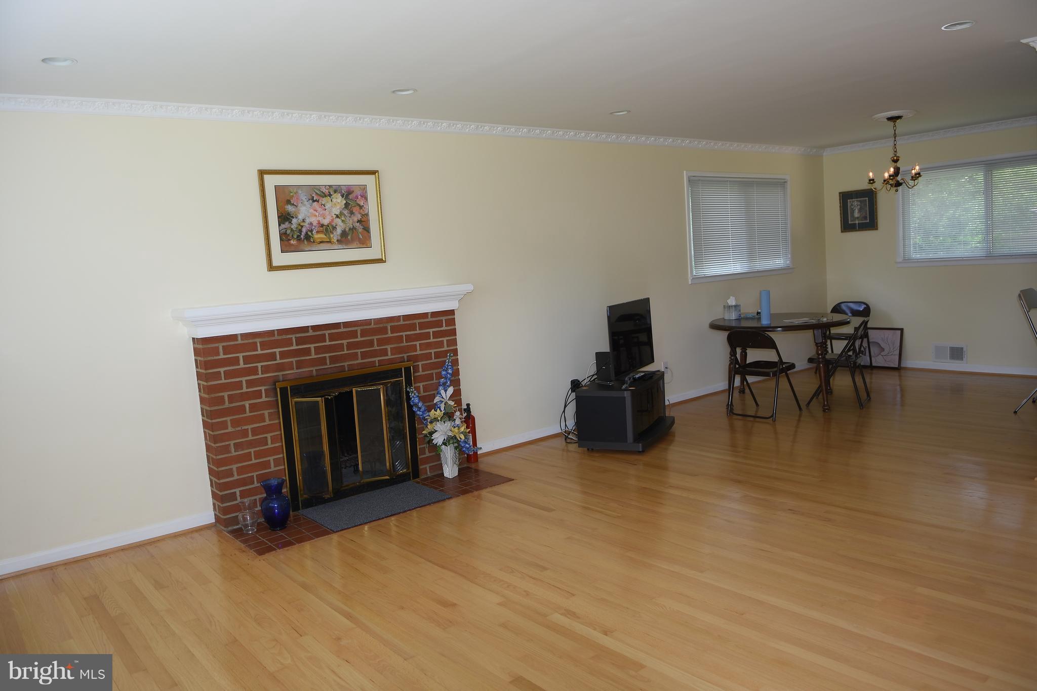 8127 Carrick Lane Springfield, VA 22151 - Photo 3 of 15 a view of a livingroom with furniture and a fireplace