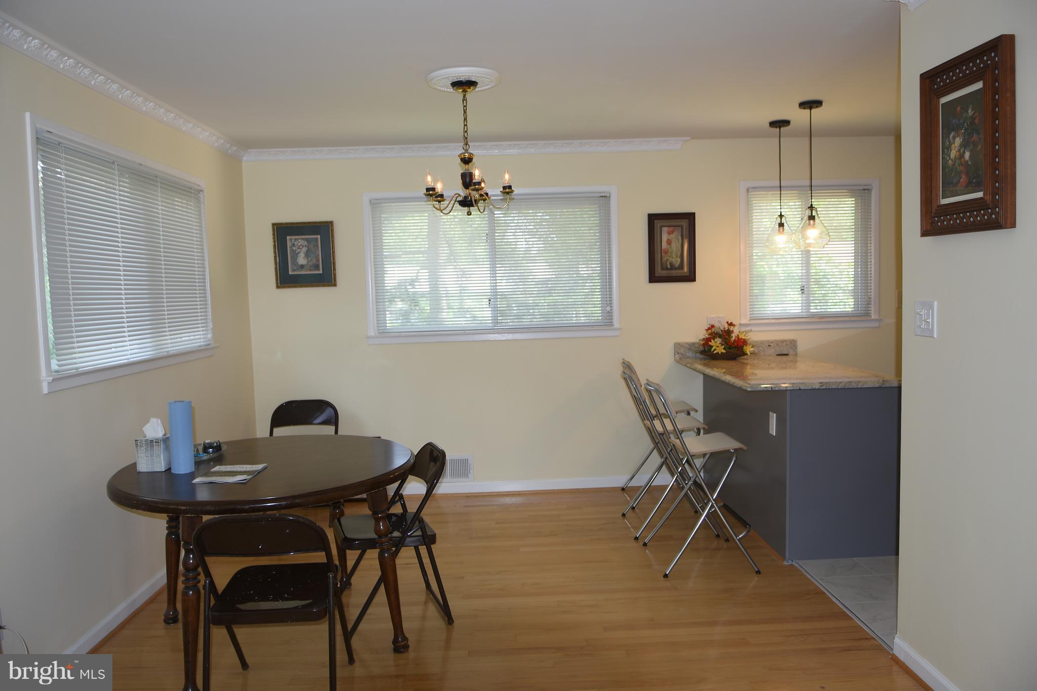 8127 Carrick Lane Springfield, VA 22151 - Photo 5 of 15 a view of a dining room with furniture window and wooden floor