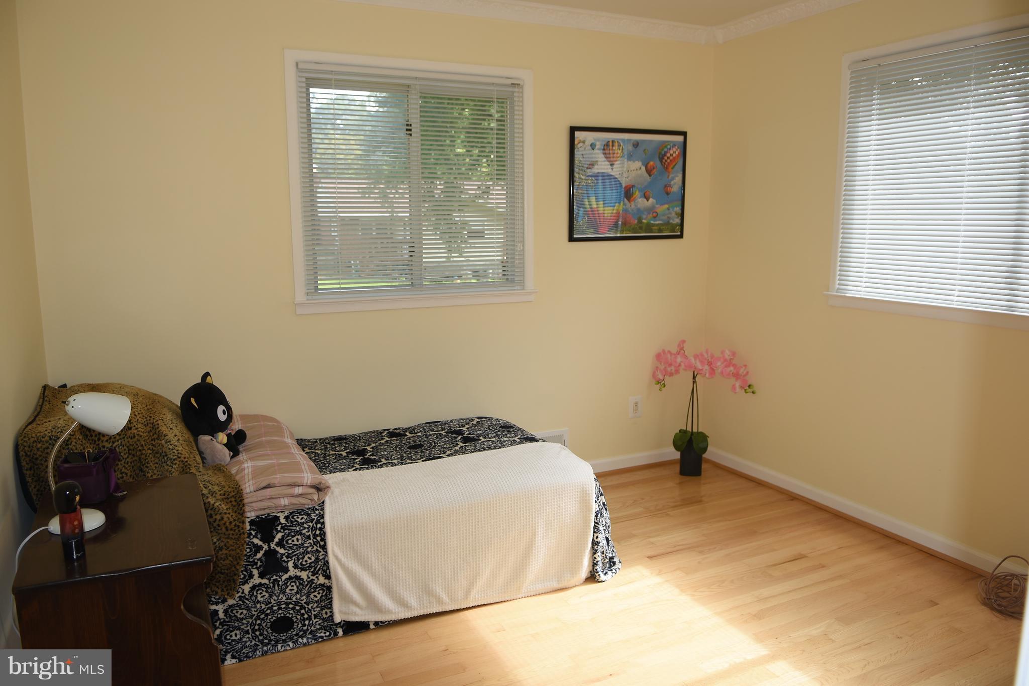 8127 Carrick Lane Springfield, VA 22151 - Photo 8 of 15 a bedroom with a bed and a window