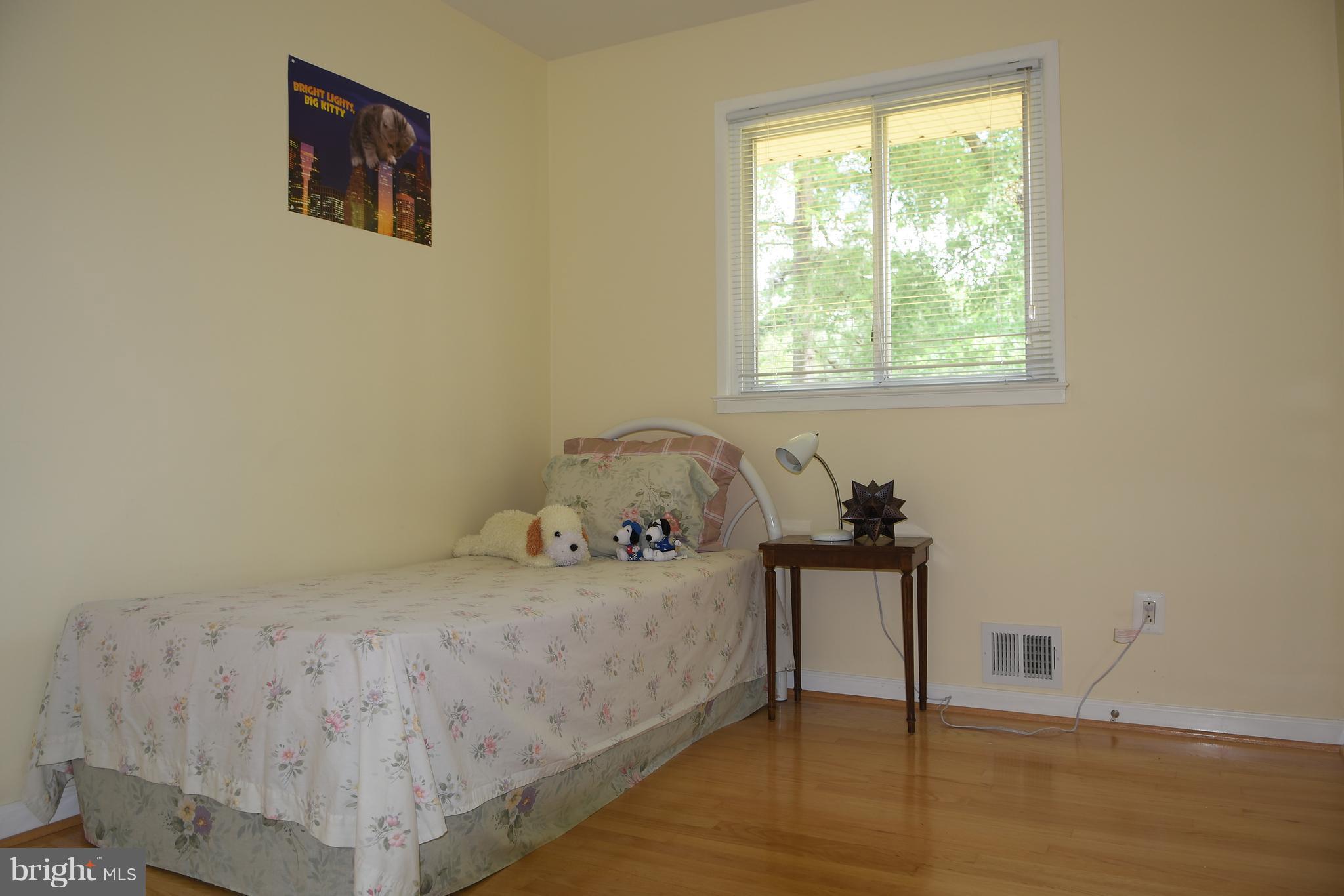 8127 Carrick Lane Springfield, VA 22151 - Photo 10 of 15 a bedroom with a bed and a window