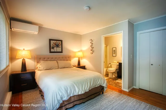 a bedroom with a bed and a lamp