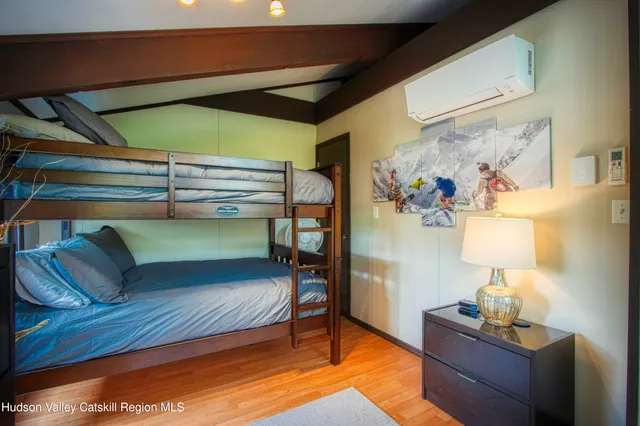 a bedroom with furniture and a lamp