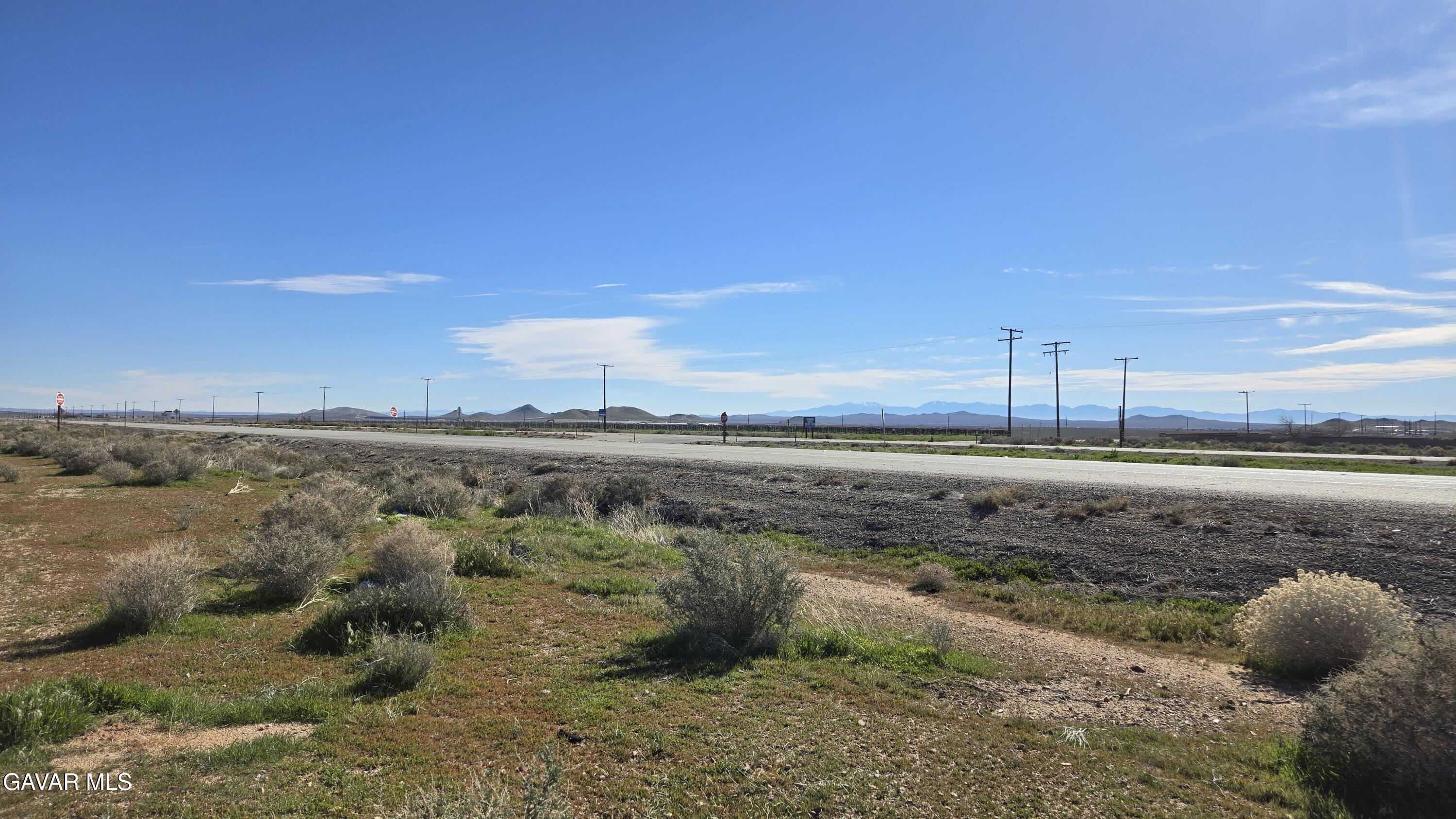 58 Business & Lonebutte Road Mojave, CA 93501 - Photo 17 of 42 a view of a dry yard with wooden fence