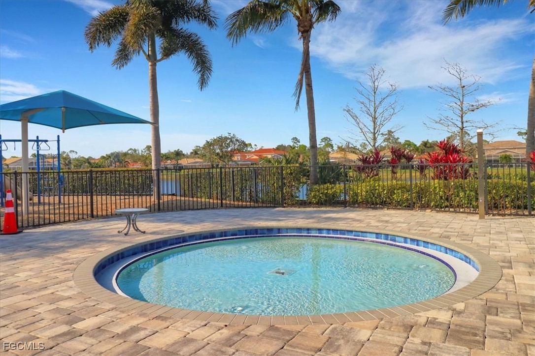 19674 Villa Rosa Loop Estero, FL 33967 - Photo 22 of 33 a view of a swimming pool with a patio