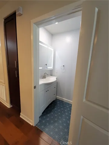 a bathroom with a sink and mirror