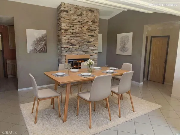 a kitchen with stainless steel appliances a stove a sink and a microwave