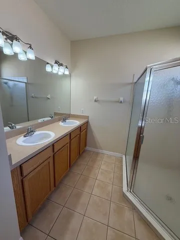 a bathroom with a sink a vanity and a mirror