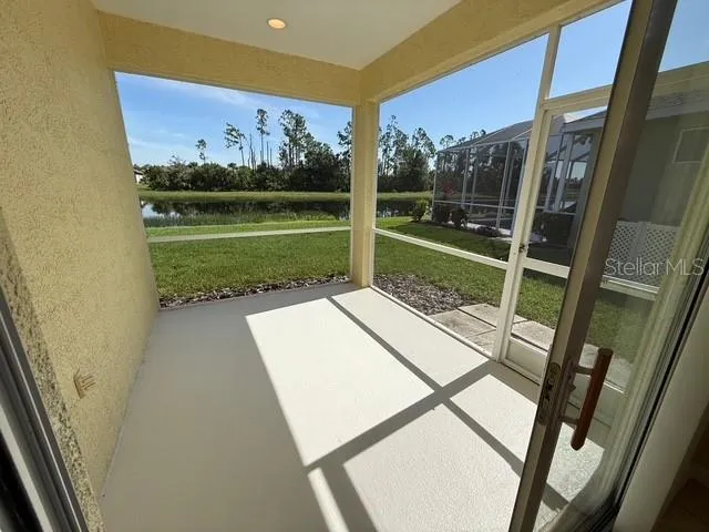 a view of a backyard with sitting area