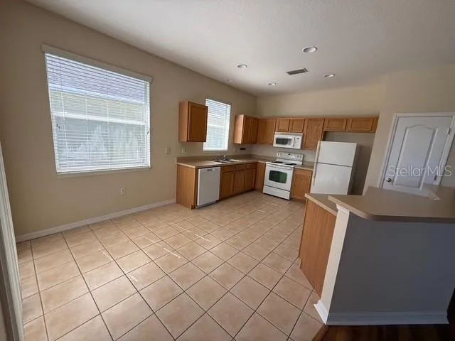 a view of kitchen and windows
