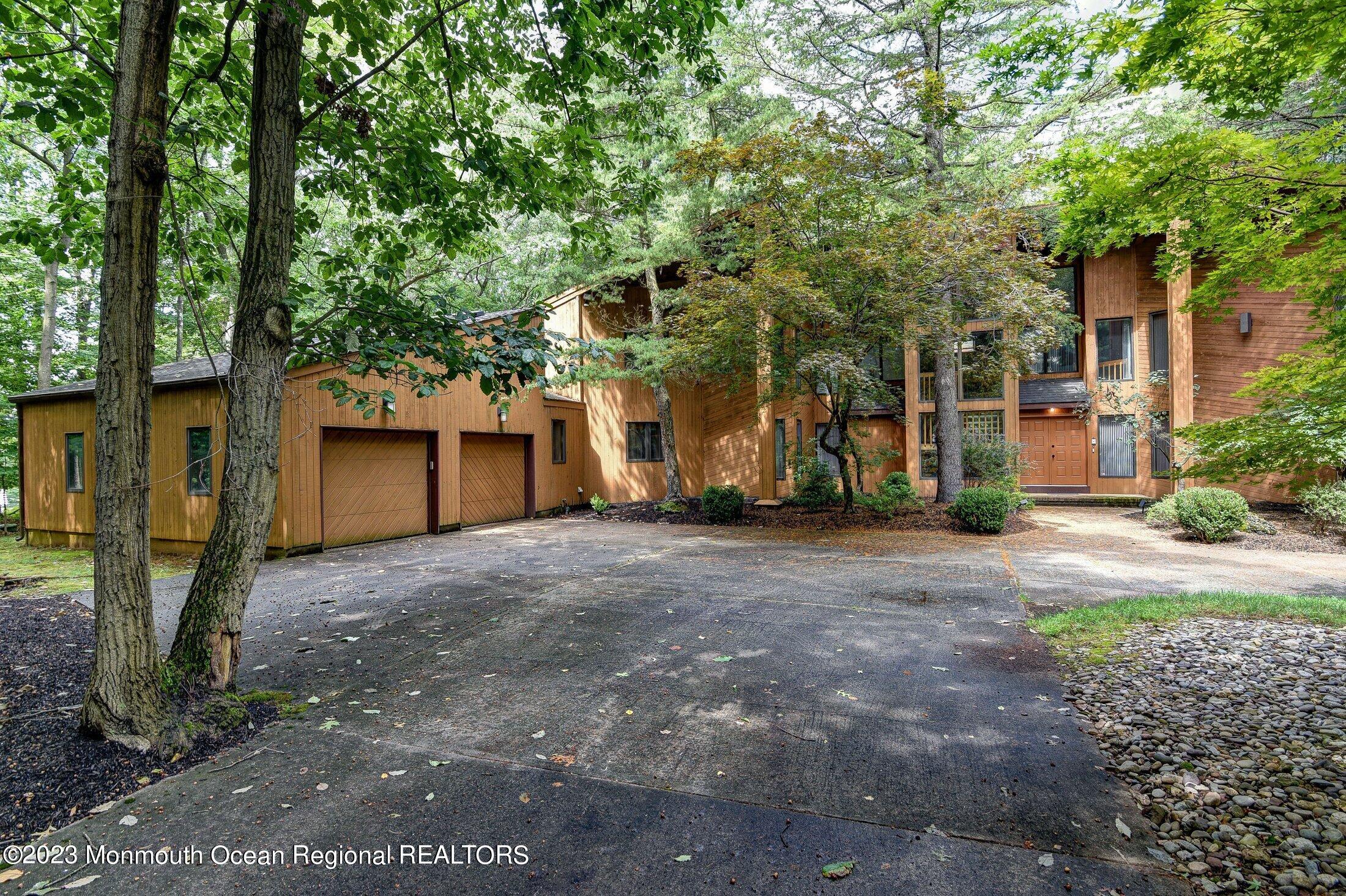 8 Doree Road Morganville, NJ 07751 - Photo 1 of 37 a view of a house with a tree and a yard