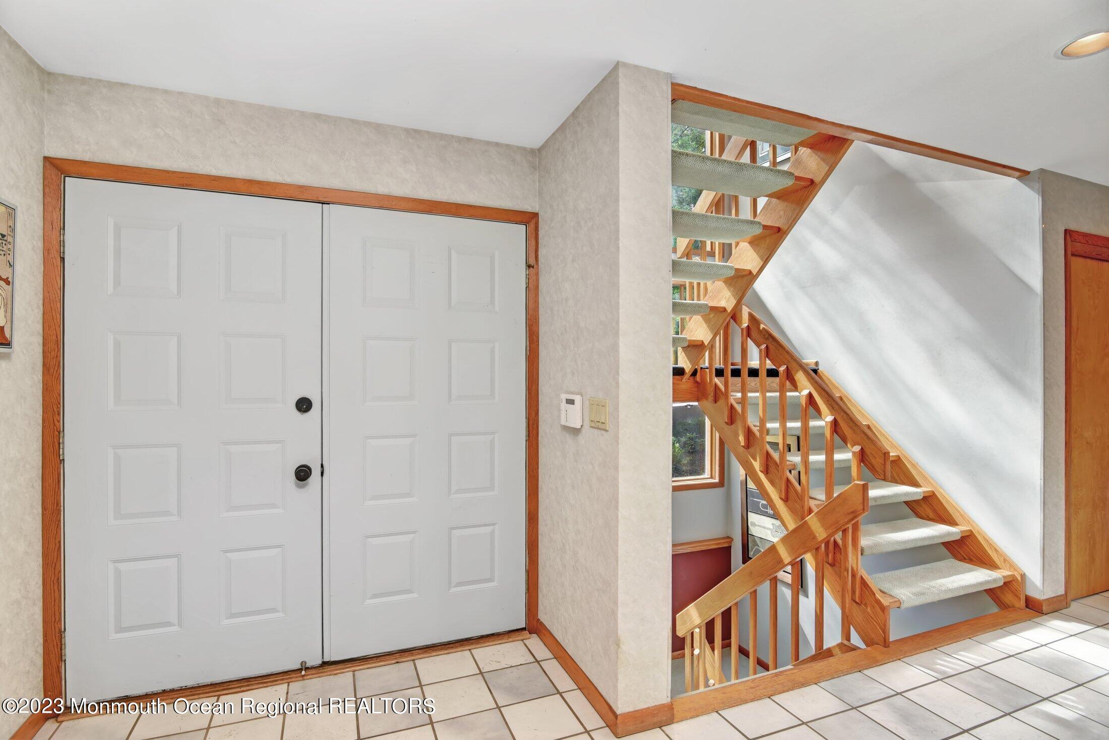 8 Doree Road Morganville, NJ 07751 - Photo 3 of 37 a view of an entryway with wooden floor