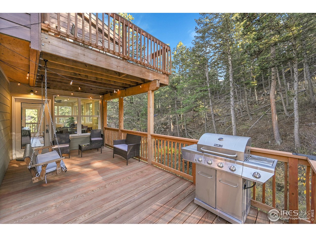 a view of a patio with wooden floor