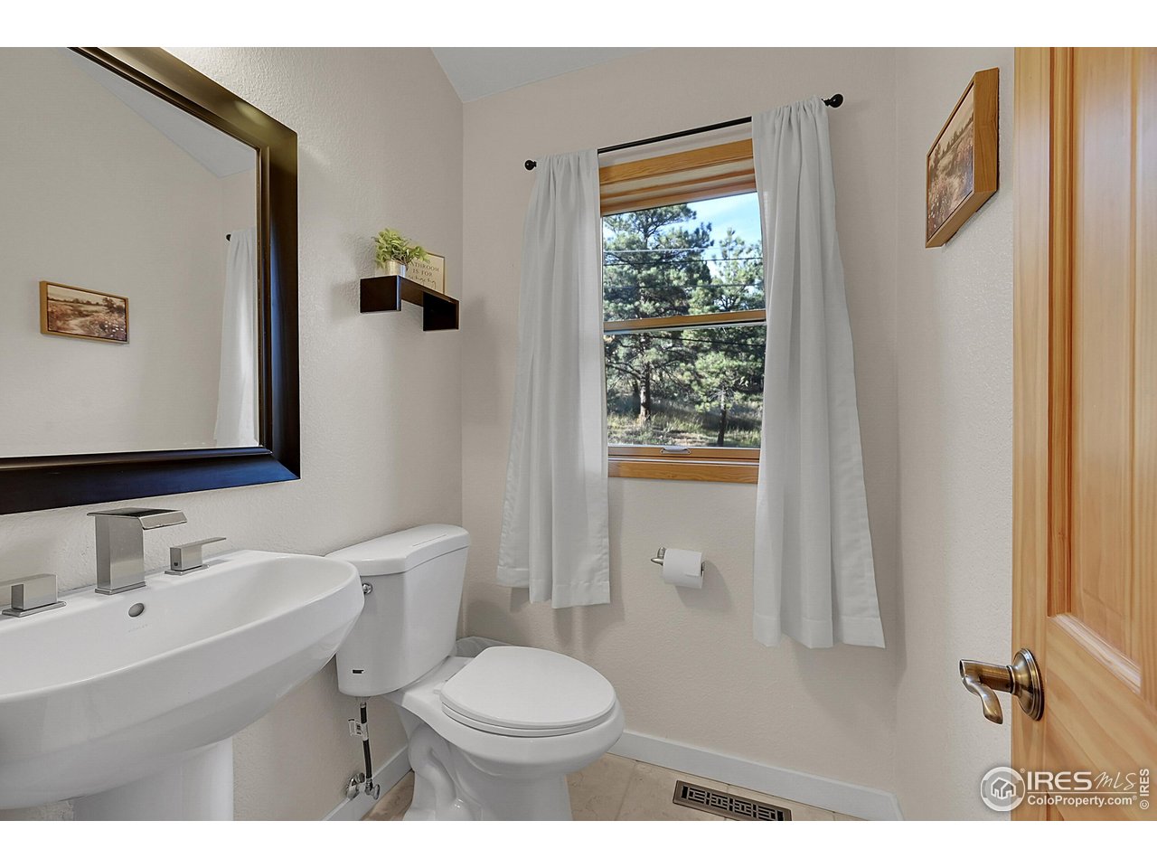 342 Brook Circle Boulder, CO 80302 - Photo 11 of 25 a bathroom with a sink toilet and shower