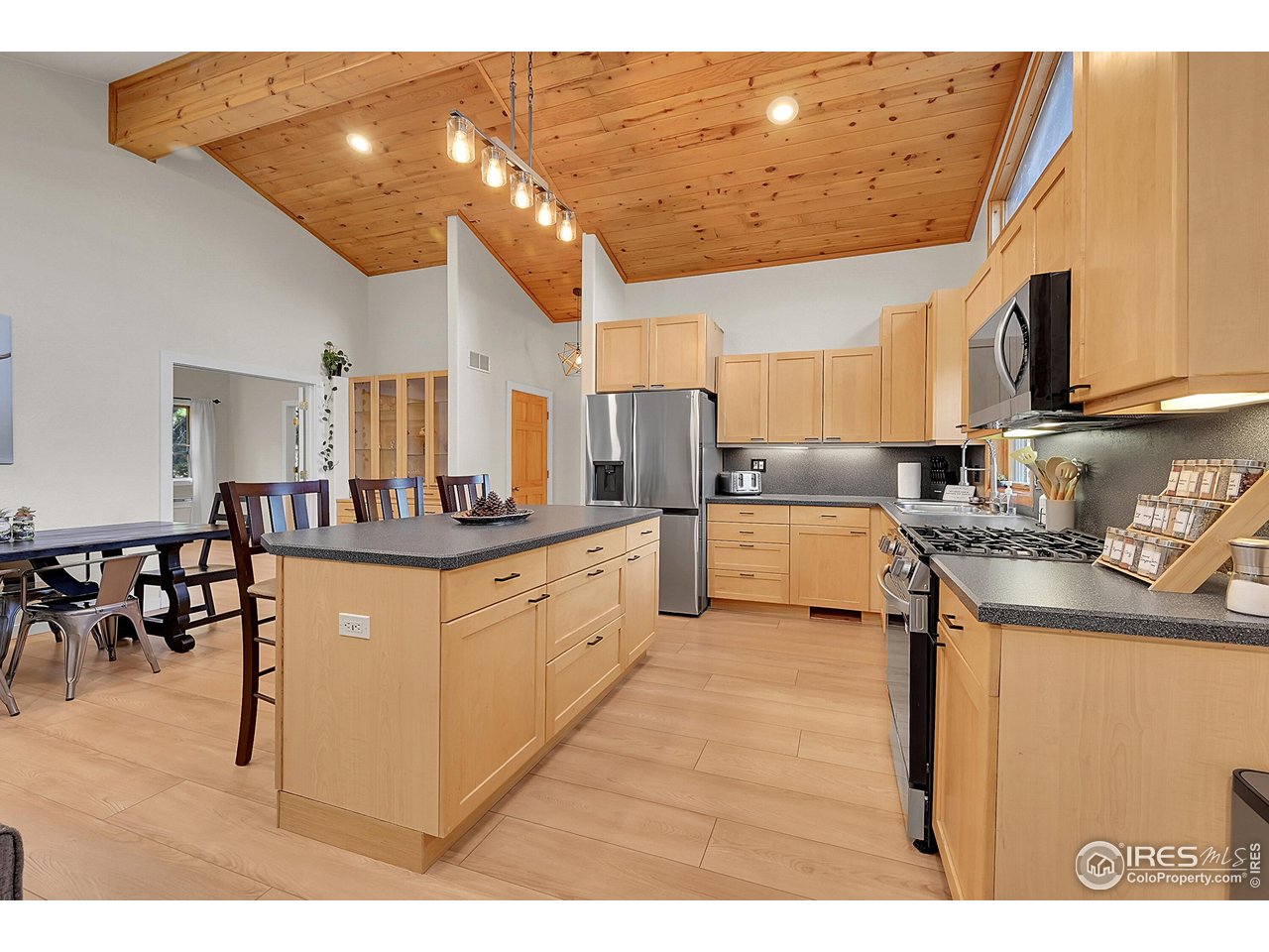 342 Brook Circle Boulder, CO 80302 - Photo 15 of 25 a kitchen with stainless steel appliances granite countertop a sink a stove and a refrigerator