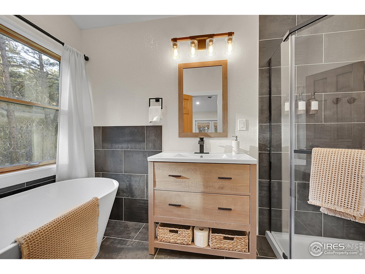342 Brook Circle Boulder, CO 80302 - Photo 20 of 25 a bathroom with a sink mirror and tub