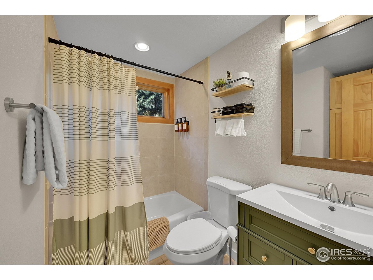 342 Brook Circle Boulder, CO 80302 - Photo 7 of 25 a bathroom with a sink and a mirror