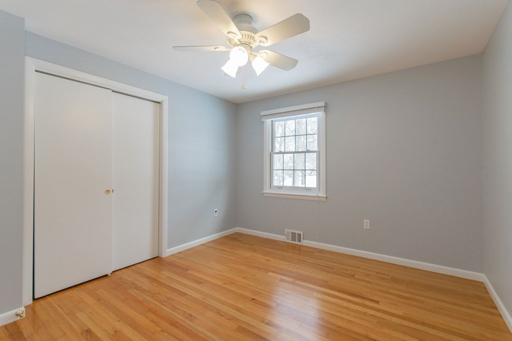 214 Captain Road Longmeadow, MA 01106 - Photo 15 of 29 wooden floor in an empty room with a window