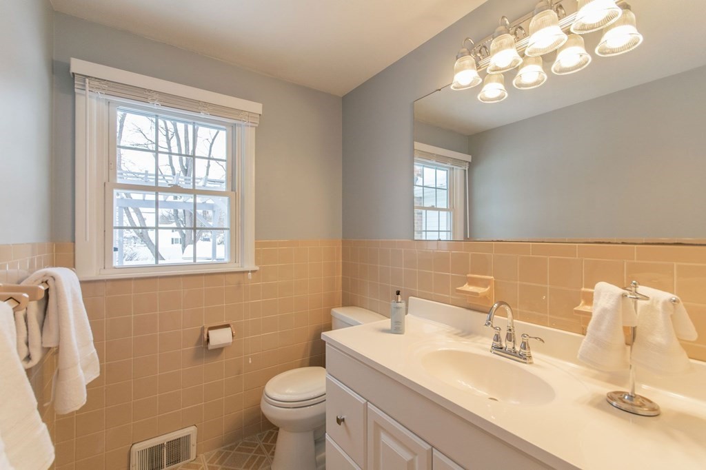 214 Captain Road Longmeadow, MA 01106 - Photo 17 of 29 a bathroom with a toilet sink and mirror