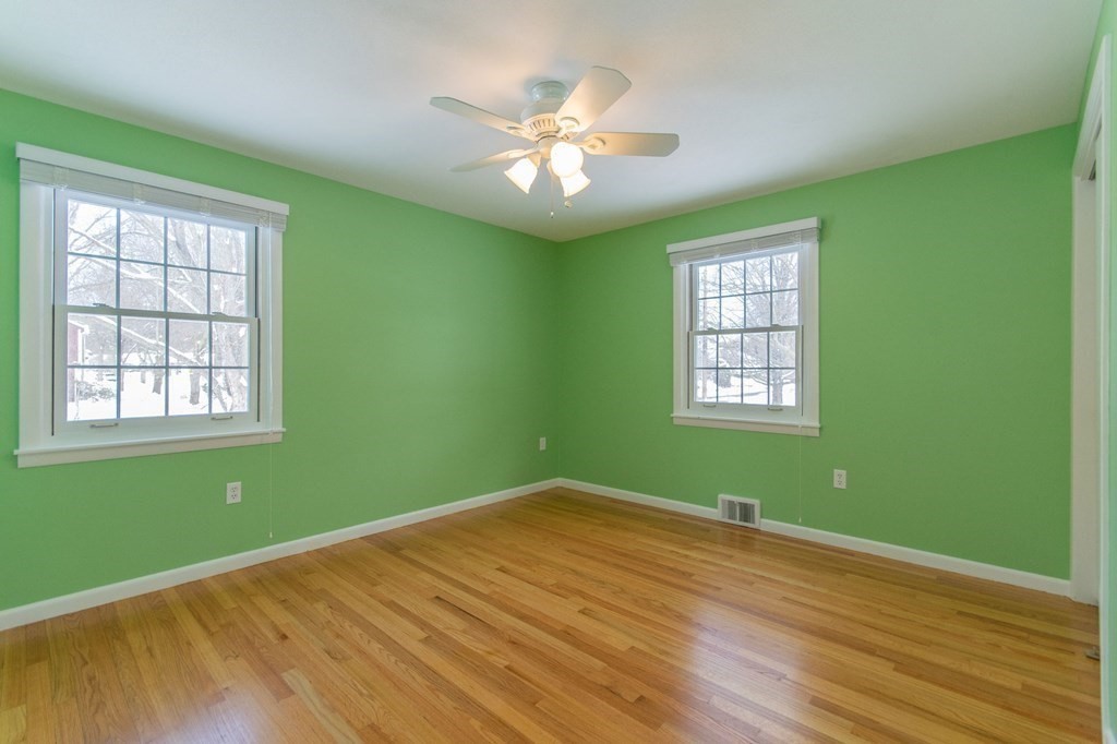 214 Captain Road Longmeadow, MA 01106 - Photo 18 of 29 a view of a room with window ceiling fan and hardwood