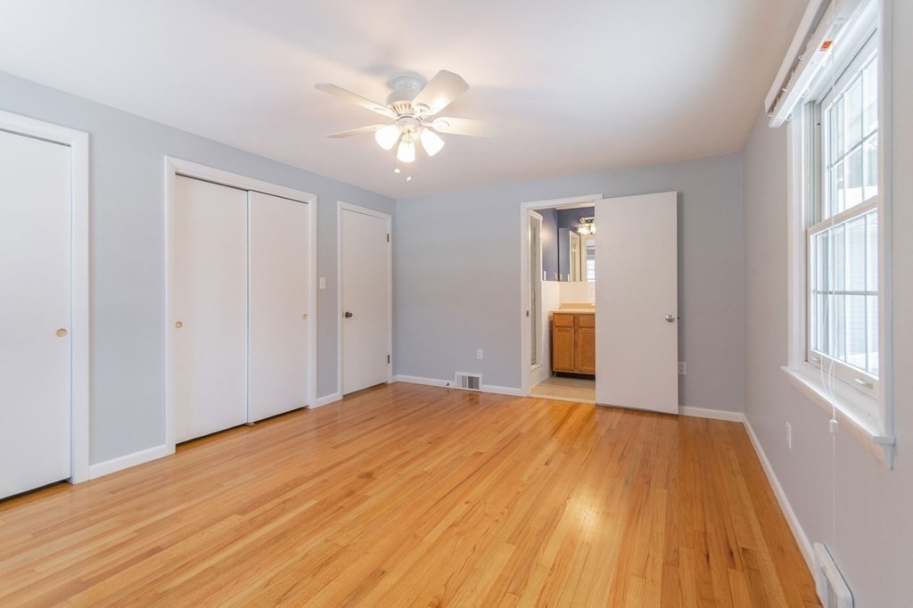 214 Captain Road Longmeadow, MA 01106 - Photo 20 of 29 a view of empty room with wooden floor and fan