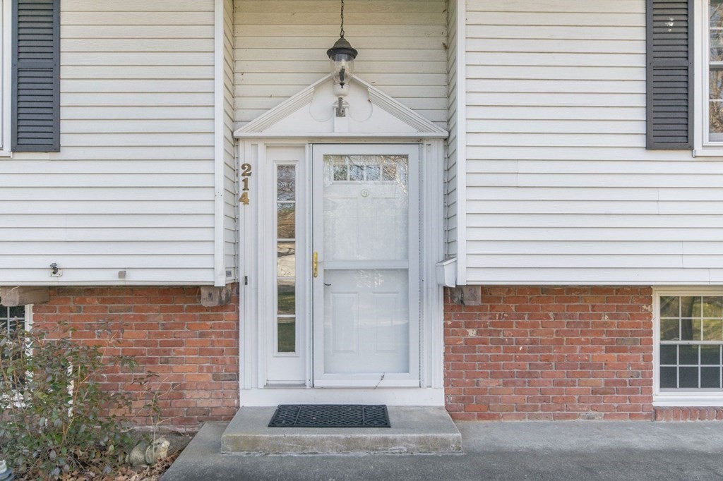 214 Captain Road Longmeadow, MA 01106 - Photo 2 of 29 a view of a brick house with a large windows