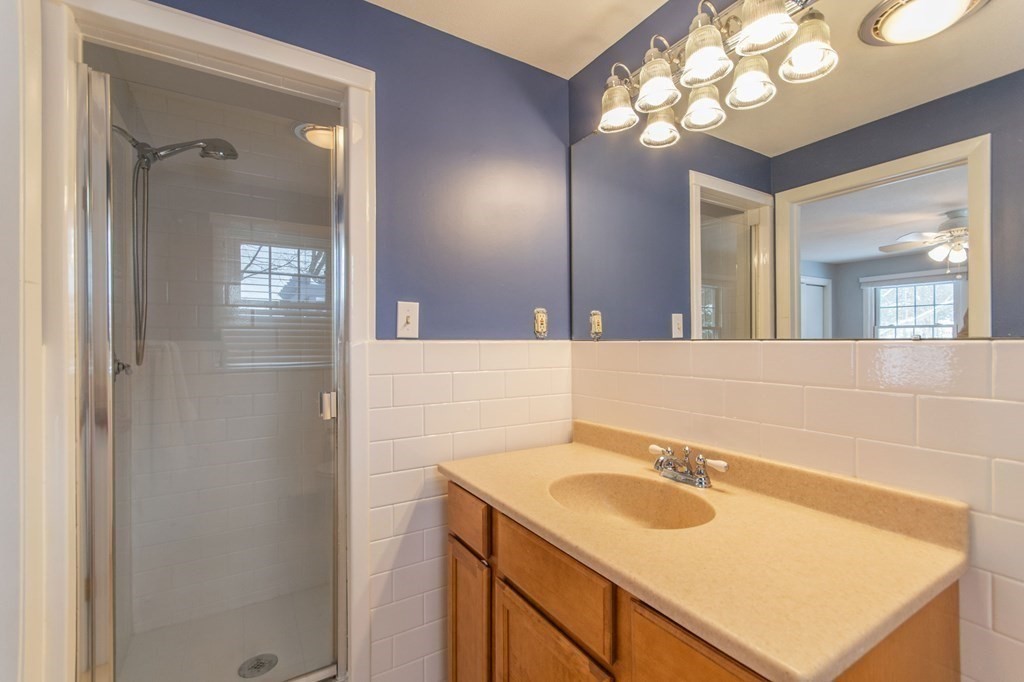 214 Captain Road Longmeadow, MA 01106 - Photo 21 of 29 a bathroom with a sink vanity and a mirror