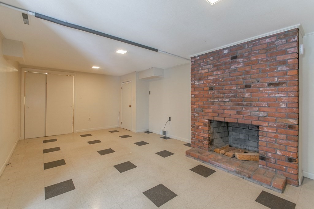 214 Captain Road Longmeadow, MA 01106 - Photo 22 of 29 a living room with furniture and a fireplace