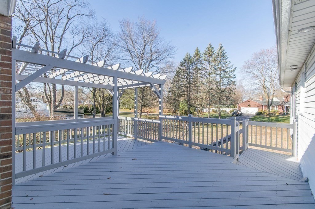 214 Captain Road Longmeadow, MA 01106 - Photo 27 of 29 a view of a roof deck with wooden floor and fence