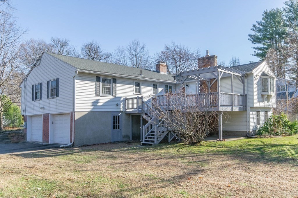 214 Captain Road Longmeadow, MA 01106 - Photo 4 of 29 a view of a house with a yard and a large tree