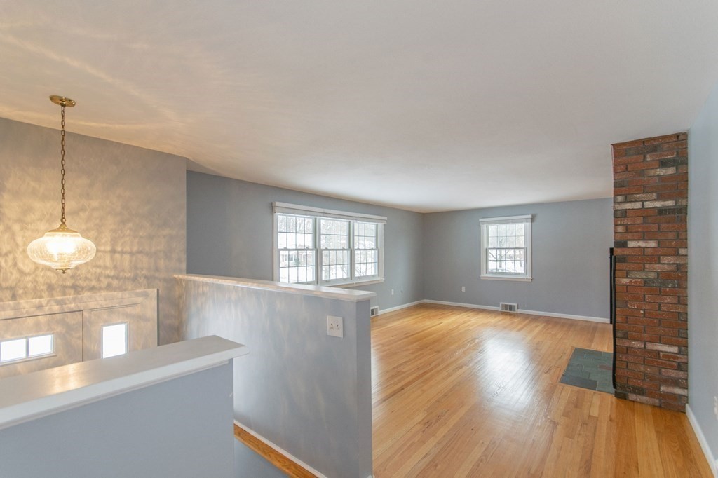 214 Captain Road Longmeadow, MA 01106 - Photo 6 of 29 a view of empty room with wooden floor and fan