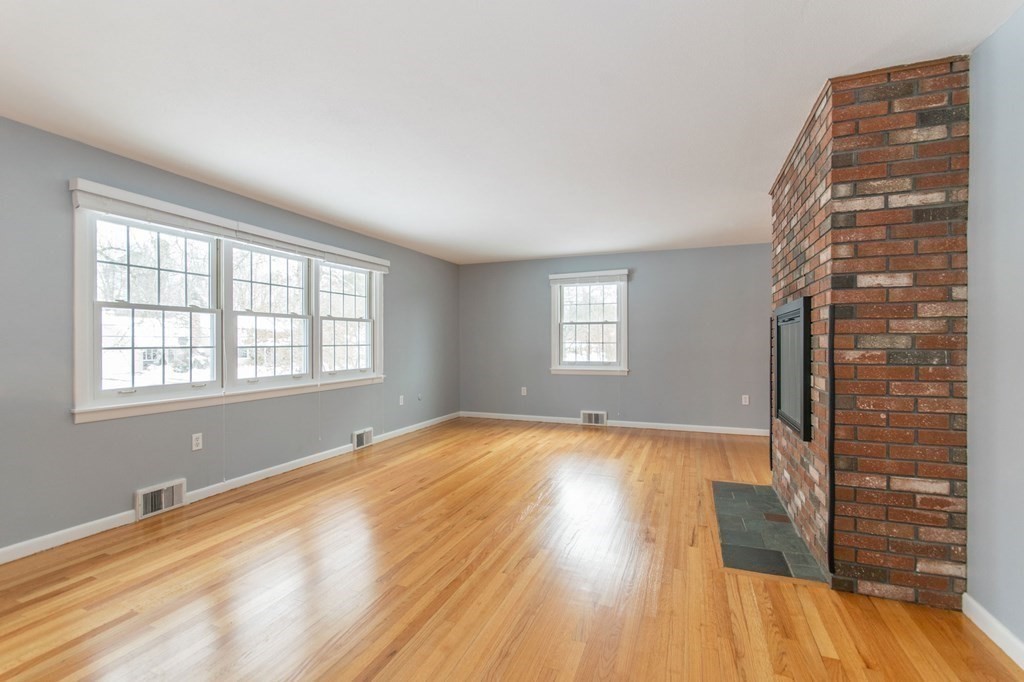 214 Captain Road Longmeadow, MA 01106 - Photo 7 of 29 a view of an empty room with wooden floor and a window