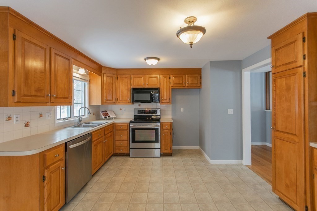 214 Captain Road Longmeadow, MA 01106 - Photo 10 of 29 a kitchen with stainless steel appliances granite countertop a refrigerator a sink dishwasher stove and oven