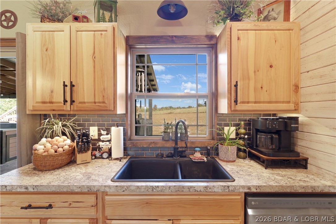 118 Uncle Dee Road Brumley, MO 65017 - Photo 20 of 57 Big sink and custom cabinets.