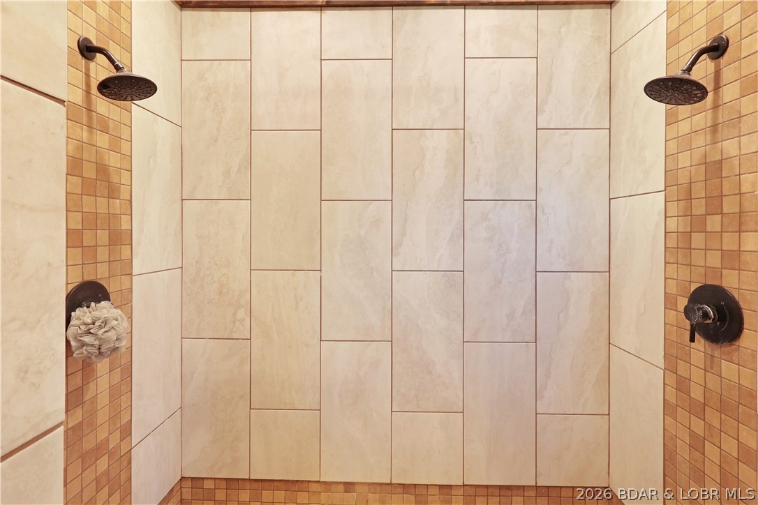 118 Uncle Dee Road Brumley, MO 65017 - Photo 27 of 57 Dual shower heads and beautiful tile work.
