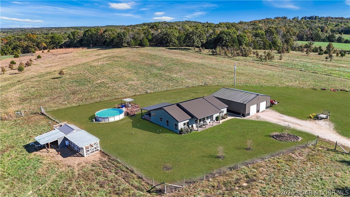 118 Uncle Dee Road Brumley, MO 65017 - Photo 6 of 57 Above ground pool and custom chicken coop with run