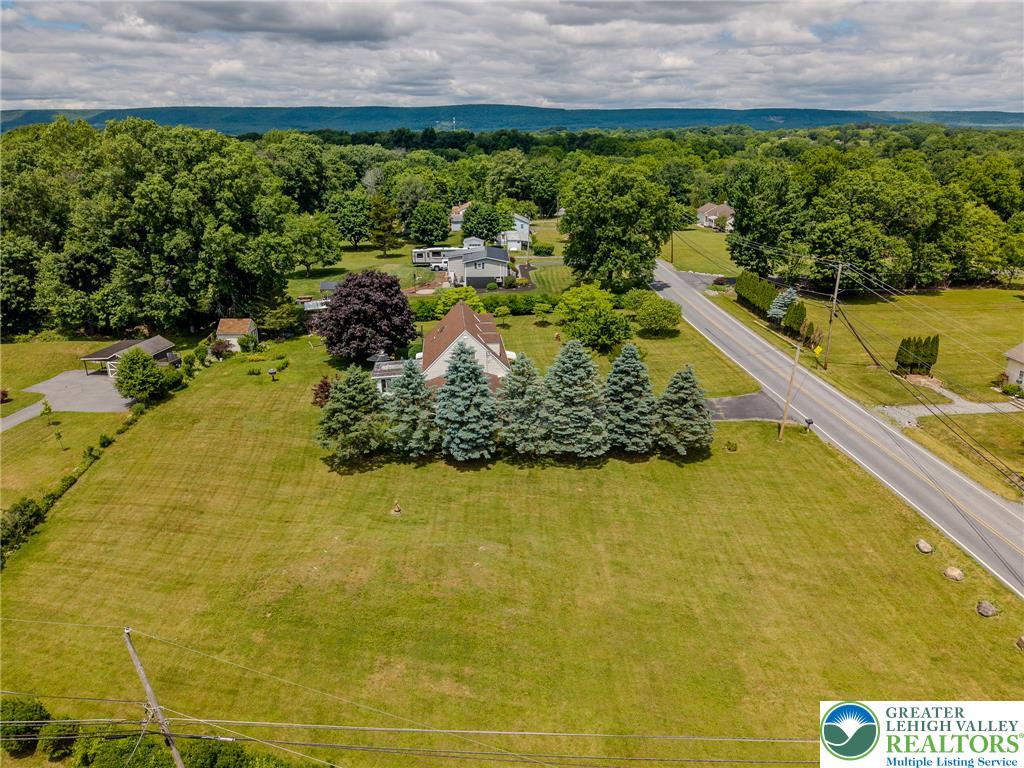 40 Locke Heights Road Bangor, PA 18013 - Photo 7 of 28 An aerial perspective reveals a serene home, surrounded by verdant trees and expansive green grounds.