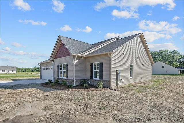 a kitchen with a sink cabinets and wooden floor