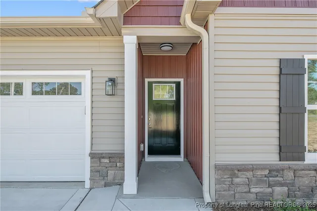 a kitchen with a sink stove top oven and cabinets