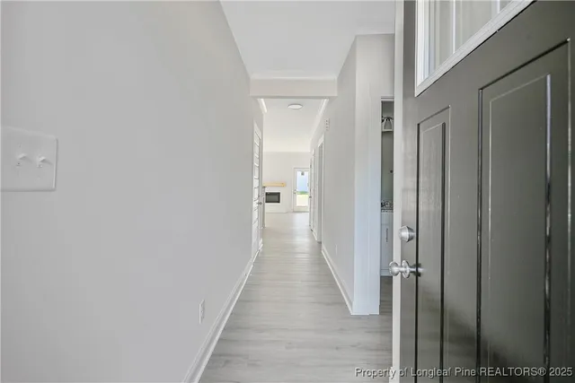 a view of main area fire place window and wooden floor