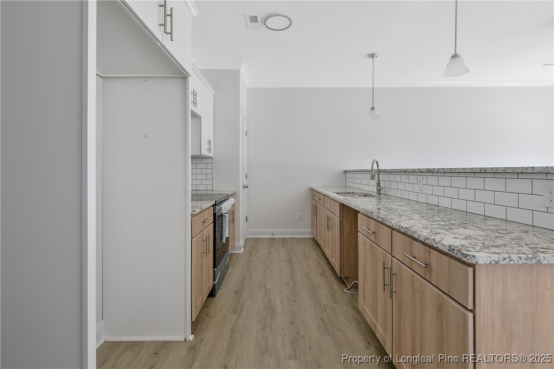 4905 High Branch Court Stedman, NC 28391 - Photo 10 of 47 a kitchen with stainless steel appliances granite countertop a sink and dishwasher