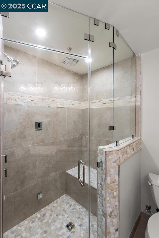1132 Running Springs Road, Unit 11 Walnut Creek, CA 94595 - Photo 7 of 7 a bathroom with a shower a toilet and sink