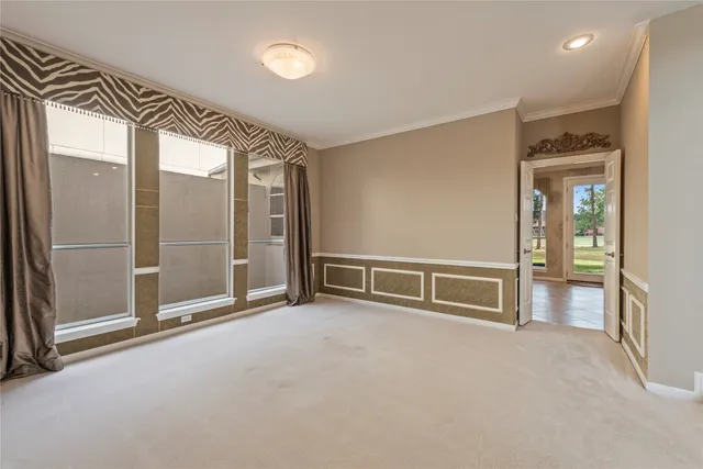 a kitchen with stainless steel appliances granite countertop a stove top oven a refrigerator and white cabinets