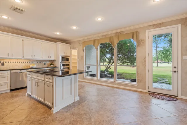 a utility room with sink dryer and washer